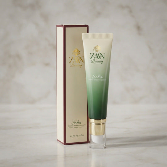 SOHA Wrinkle Smoothing Serum — cream and green gradient tube with gold pump beside the ZAA'N Beauty box on marble.