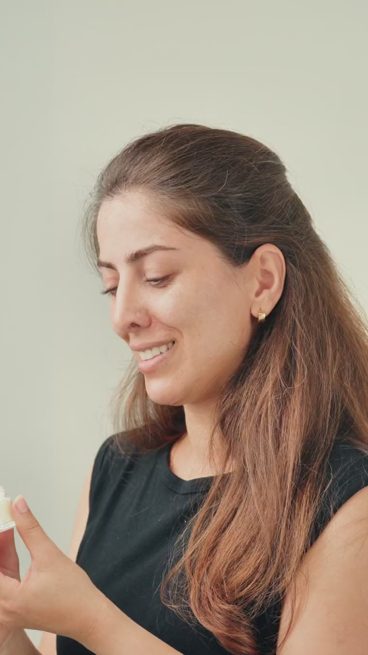 Model holding ZIBA Eye Crème