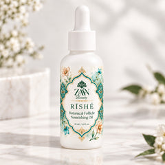 RĪSHÉ Botanical Nourishing Hair Oil bottle on white marble